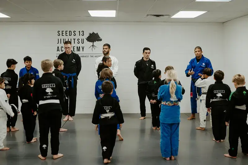 Kids class at Seeds 13 under the academy wall