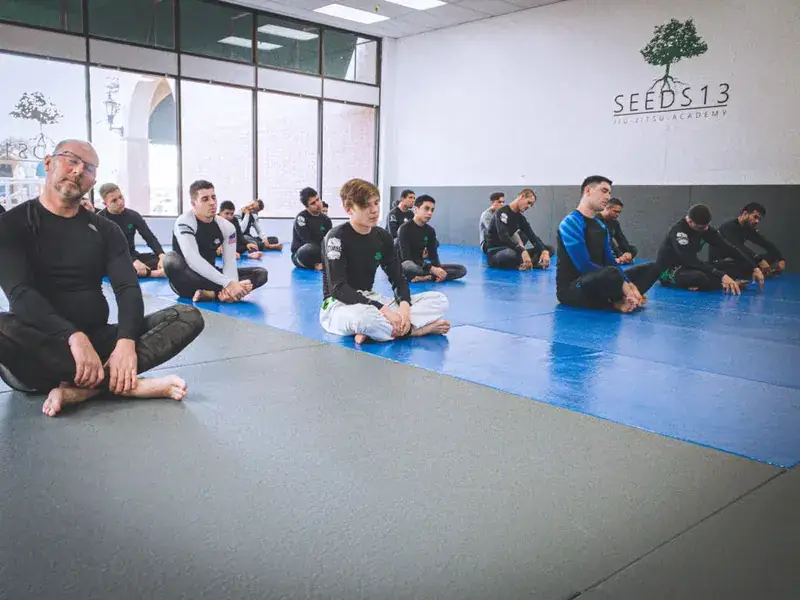 Seeds 13 instructors on the mat